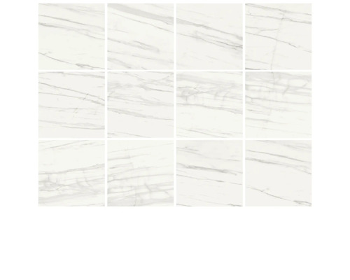 Několik bílých dlaždic s mramorovým vzhledem.