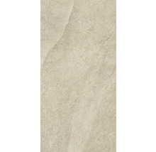 Detail béžové podlahové dlaždice s matným povrchem.