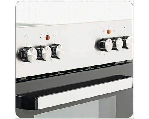 Detailní záběr sporáku s otočnými knoflíky pro regulaci teploty