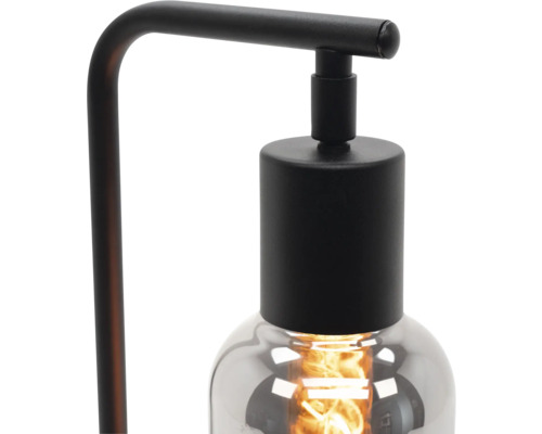 Stolní lampa se skleněným stínidlem.