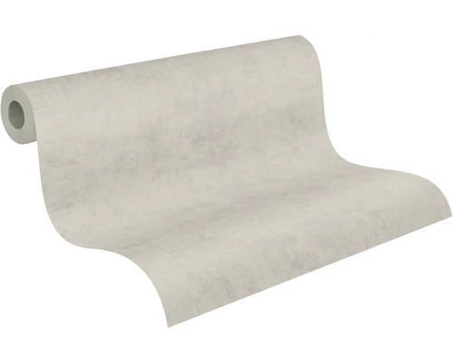 Vliesová tapeta se vzhledem betonu ve světle šedé barvě, mírně strukturovaný povrch, částečně rozvinutá role.