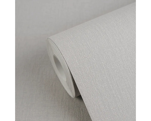 Světle šedá vliesová tapeta s lněnou strukturou na roli.