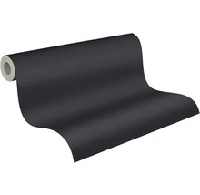 Částečně rozvinutá tmavě šedá strukturovaná tapeta v roli.