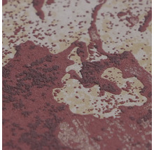 Detailní záběr mramorované povrchové struktury s kropenatými a zrnitými detaily.