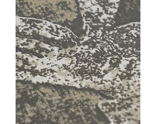 Detailní záběr strukturované vliesové tapety s abstraktním vzorem.