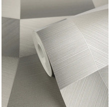 Šedá vliesová tapeta v roli s geometrickým vzorem a jemnou liniovou strukturou.