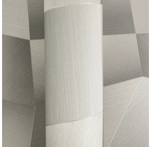 Vliesová tapeta s moderním geometrickým vzorem trojúhelníků a jemnou linkovou strukturou.