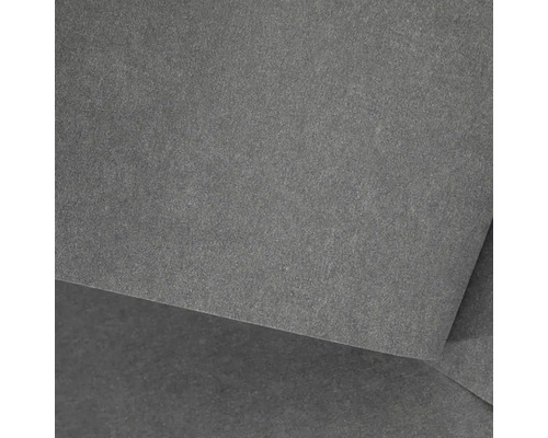 Detailní pohled na tmavě šedou dlaždici z jemné kameniny s jemně strukturovaným, matným povrchem.