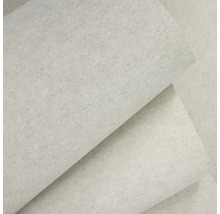 Vliesová tapeta s jemnou strukturou a vzhledem omítky.