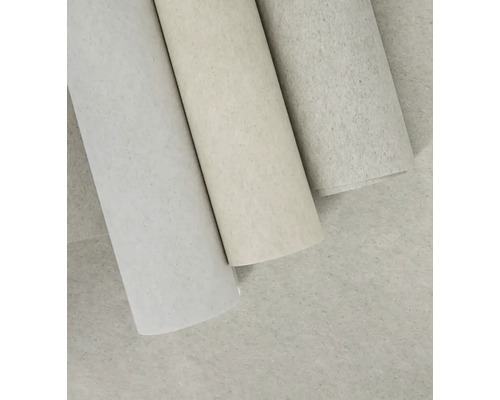 Tři role strukturované tapety s kropenatým povrchem.