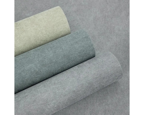 Tři role vliesové tapety se vzhledem betonu a strukturovaným povrchem v béžové, tmavě šedé a světle šedé barvě.