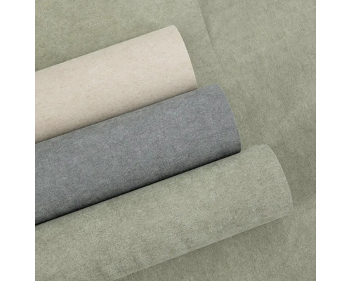 Tři role vliesové tapety se strukturovaným povrchem v různých barvách.