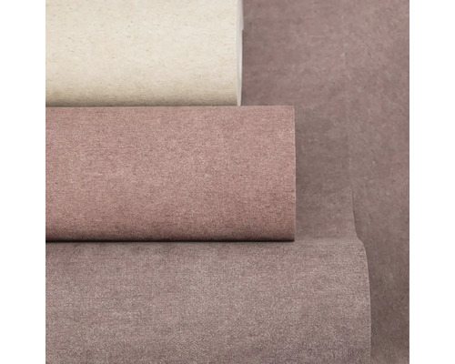 Detailní pohled na tři role strukturovaných vliesových tapet v různých odstínech.