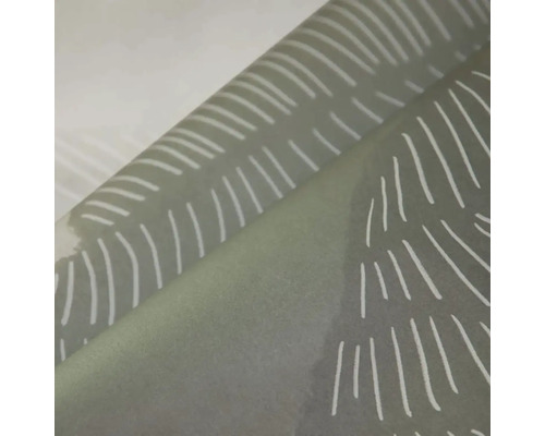 Detail tapety s abstraktním liniovým vzorem v podobě listu.
