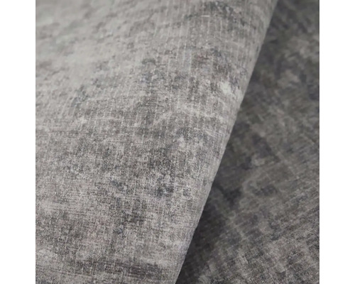 Detailní záběr šedého koberce s vintage texturou a melírovaným vzorem tkaní.