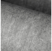 Detailní záběr strukturované vliesové tapety s jemnou povrchovou texturou.