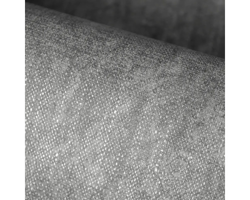 Detailní záběr strukturované vliesové tapety s jemnou povrchovou texturou.