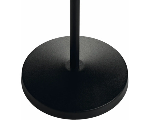 Kulatý černý kovový podstavec lampy se svislou tyčí.