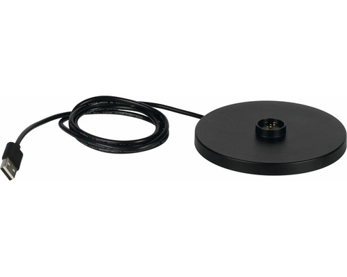 Černá kulatá nabíjecí stanice s integrovaným kabelem a USB konektorem.