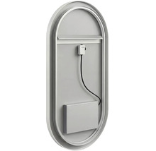 Zadní pohled na oválné zrcadlo s kovovým rámem, obsahující elektrický kabel a kryt pro instalaci.