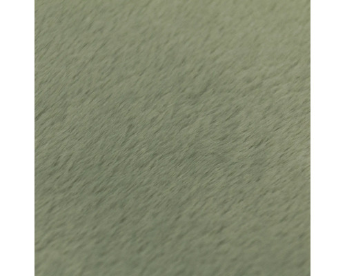 Detailní záběr na měkký, plyšový povrch látky nebo strukturu koberce.