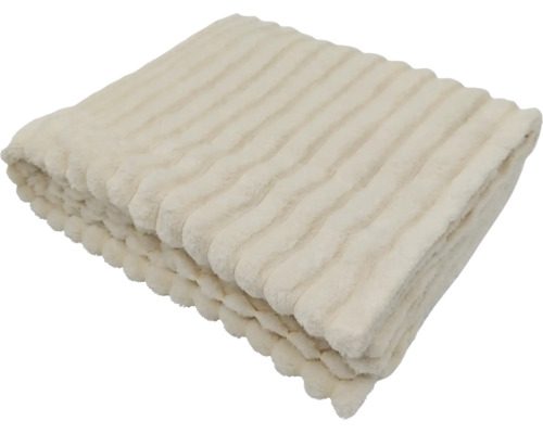 Měkká deka s pruhovanou strukturou, složená jako dekorativní bytový textil.