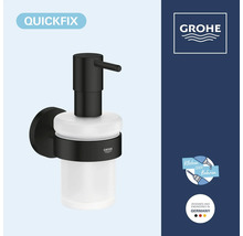 Dávkovač mýdla Grohe QuickFix pro montáž na stěnu s matnou povrchovou úpravou a skleněnou nádobkou, vhodný k lepení nebo vrtání.