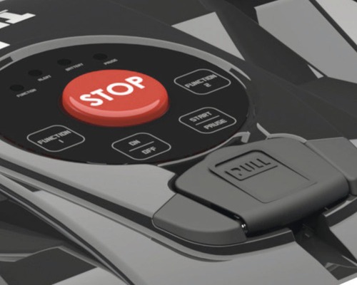 Detail ovládacích prvků robotické sekačky s tlačítkem zastavení, funkčními tlačítky a tlačítkem start-pauza.