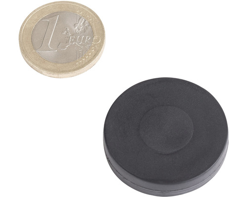 Černý gumový nárazník s euromincí pro srovnání velikosti