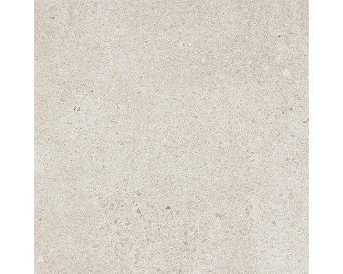 Detail světlé podlahové dlaždice s tečkovanou texturou