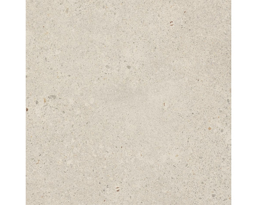 Detailní záběr podlahové dlaždice s teracovým vzhledem.