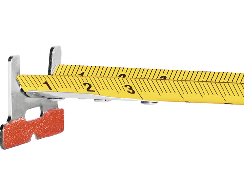 Detailní pohled na skládací metr s kovovou zarážkou