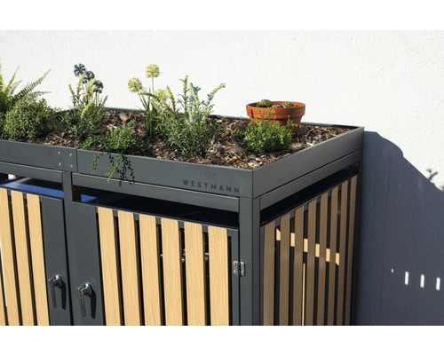 Kontejner na odpadky s výsadbou na střeše a logem Westmann.