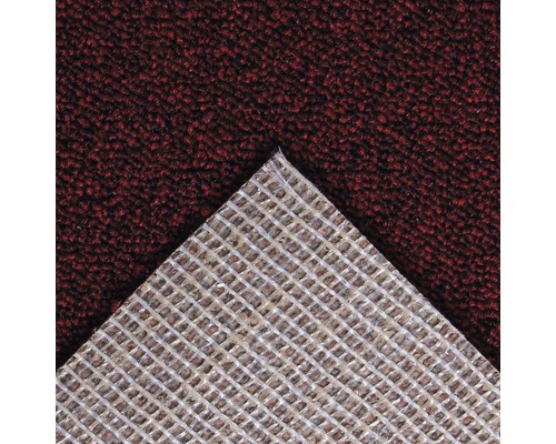 Detail koberce s tkanou strukturou na zadní straně