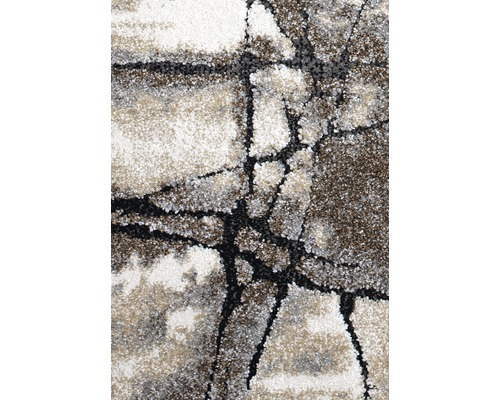 Detailní pohled na koberec s abstraktním vzorem