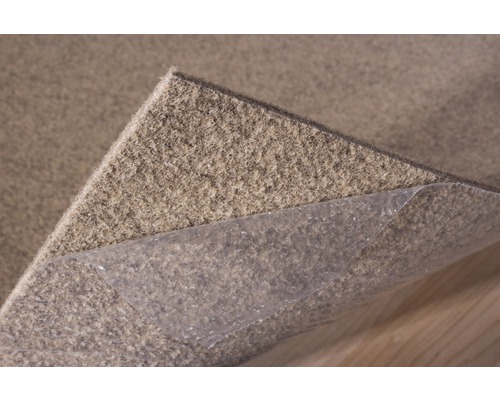 Protiskluzová podložka pod koberec s lepicí fólií pro upevnění na podklad.