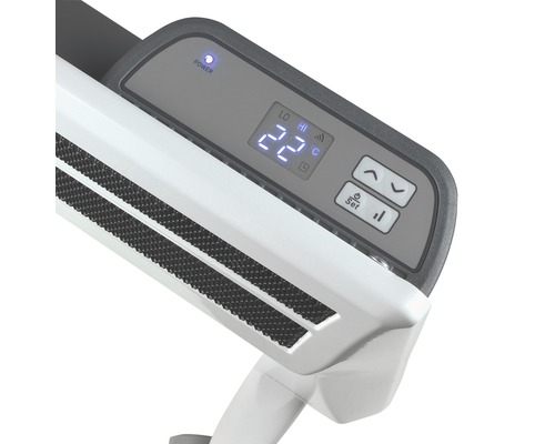 Detailní záběr topného zařízení s digitálním ukazatelem teploty a ovládacím panelem.