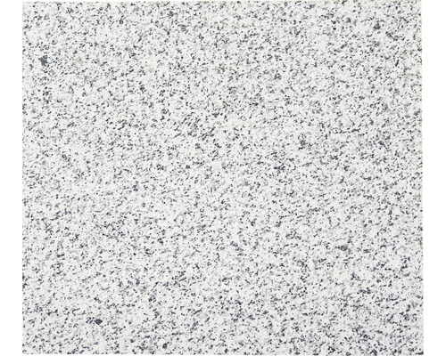 Detailní záběr žulové desky se skvrnitou texturou.