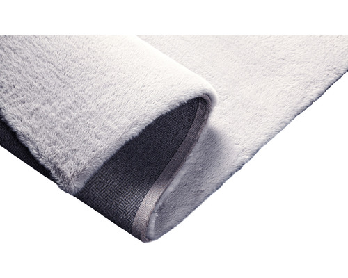 Detail světlého koberce s vlasem