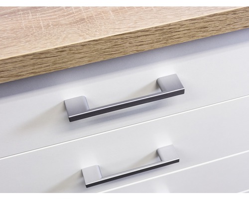 Detailní záběr dvou zásuvek s madly a pracovní desky.