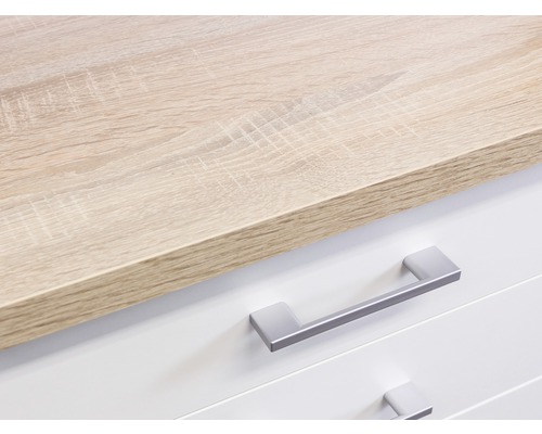 Detail komody se zásuvkami a dřevěnou deskou