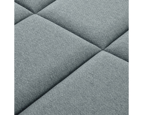 Detail čalouněného stěnového panelu se čtvercovým vzorem