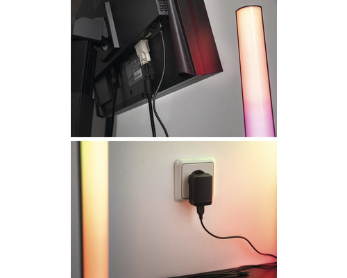 Detailní záběr monitoru s kabelovými přípojkami a stojací lampy a také napájecího zdroje v zásuvce