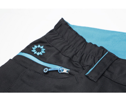 Detail kalhot se zipem a elastickým pasem