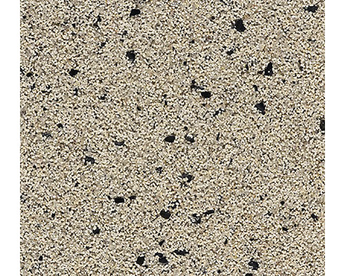 Detail povrchu s jemnou, zrnitou texturou a roztroušenými tmavými částicemi.