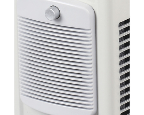 Detail klimatizační jednotky s ventilační mřížkou a otočným knoflíkem