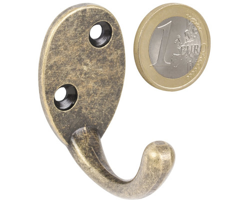 Kovový věšák na oblečení s euromincí pro srovnání velikosti