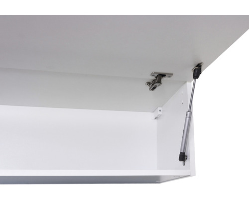 Detail otevřené nástěnné skříňky s kováním a plynovou pružinou