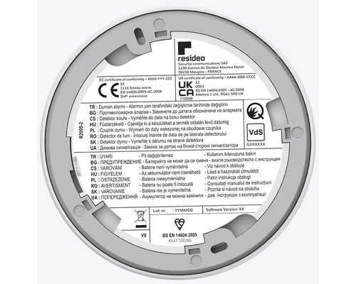 Zadní strana hlásiče kouře Resideo s certifikacemi a varováními