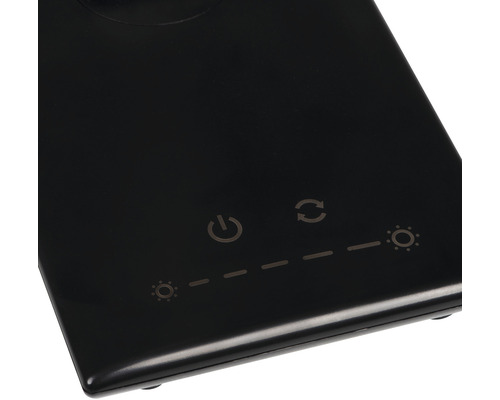 Detail ovládacích prvků stolní lampy se symbolem zapnutí/vypnutí, nastavením jasu a nastavením režimu světla.